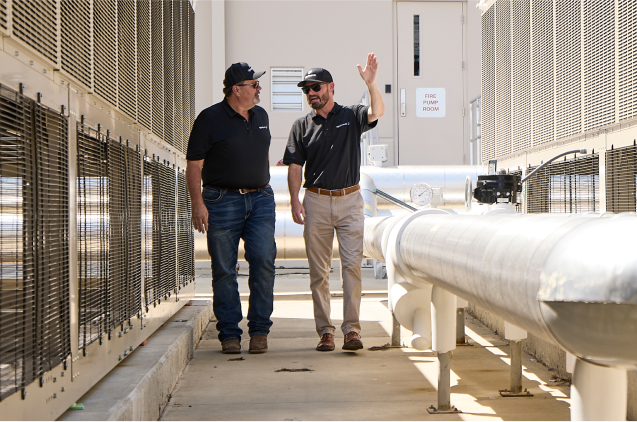 Two Upchurch employees walking around a facility