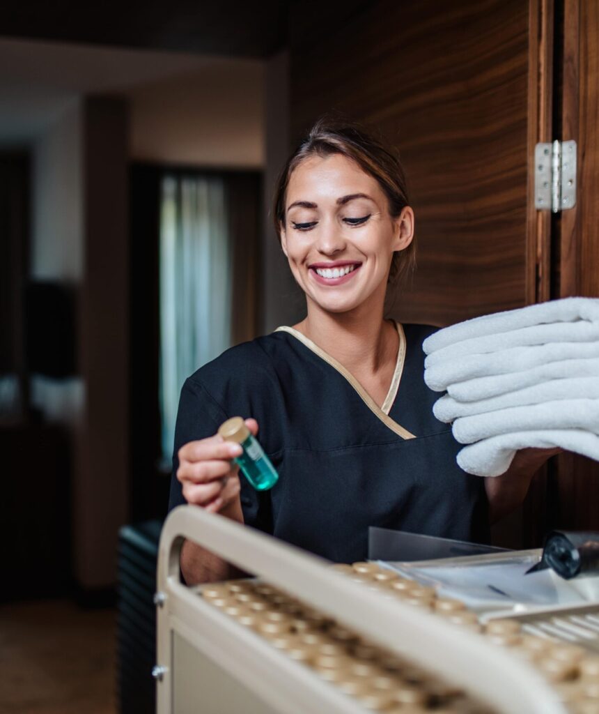 A maid exiting a hotel room