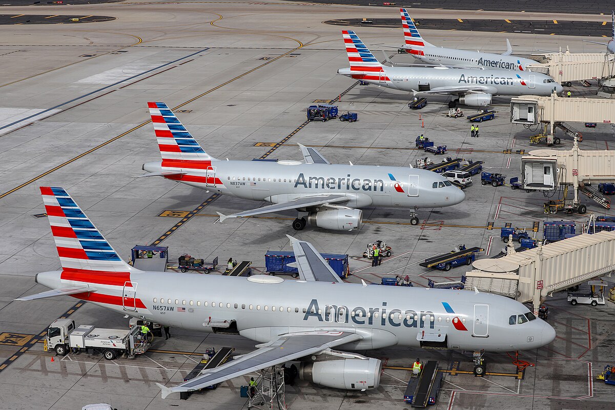 Several American Airlines planes at the terminal