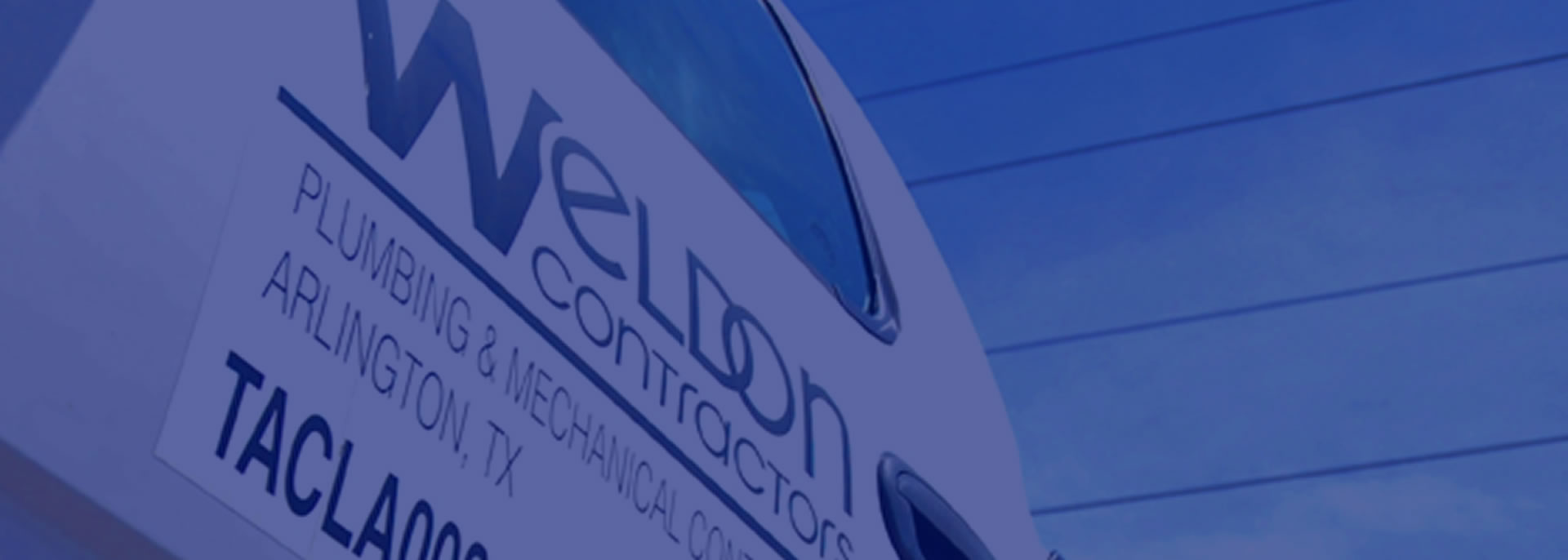 An abstract view of a truck door with Weldon's logo