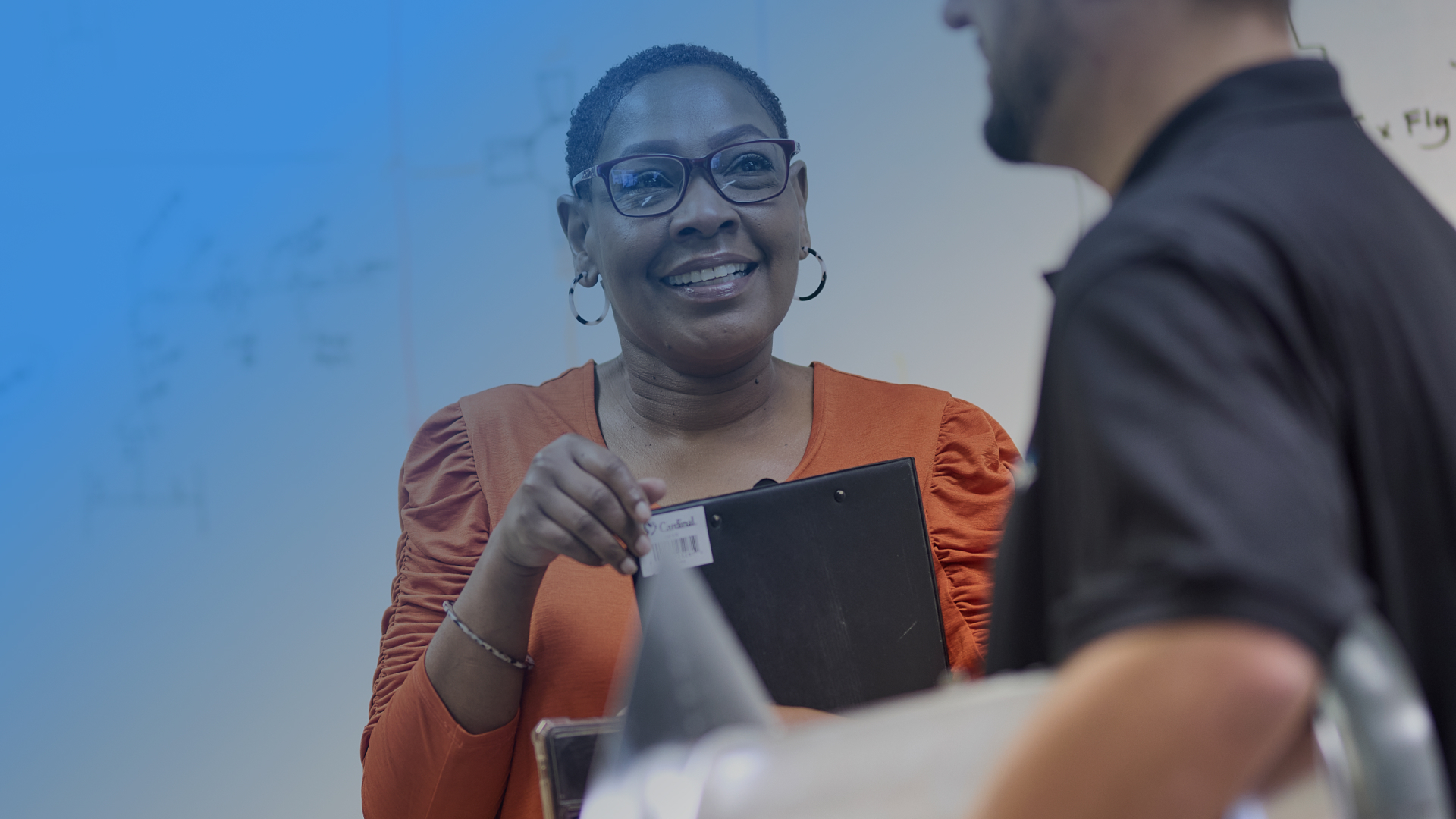 A woman discussing a service need with an Upchurch employee.